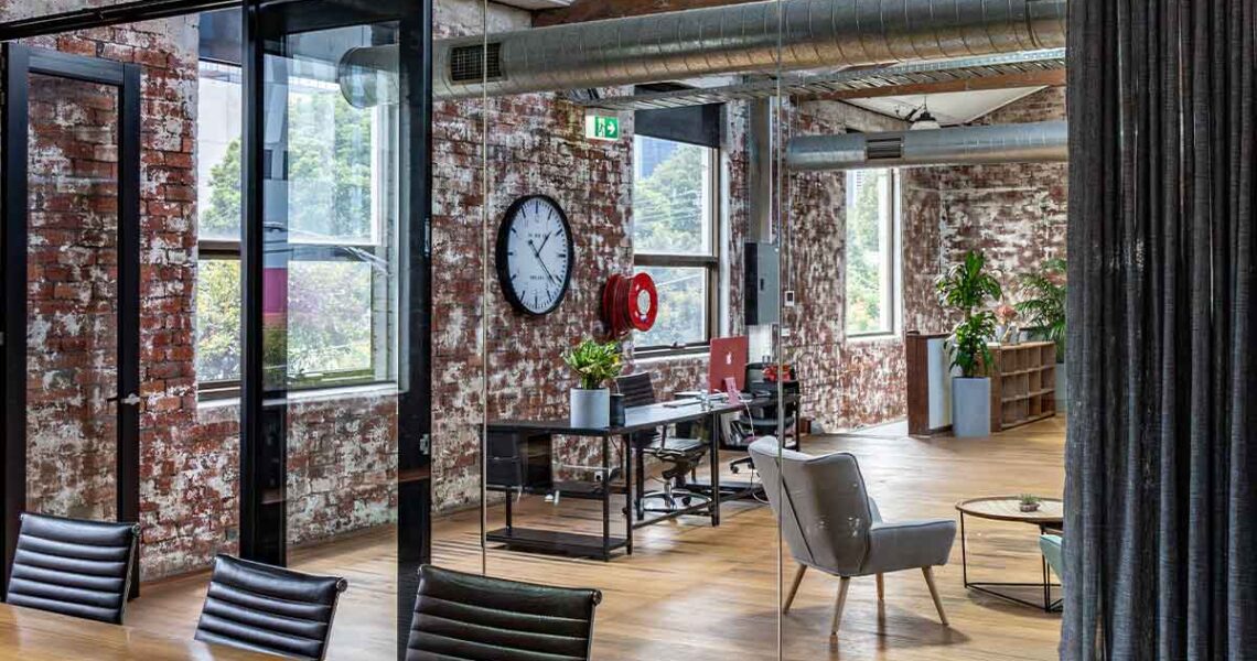 View from Queen’s Gambit boardroom into coworking and reception area at ko&co workhub south melbourne
