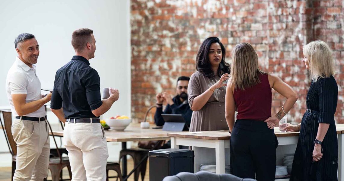 Members chatting and connecting in the ko&co workhub gathering space. South Melbourne shared office space for small business owners