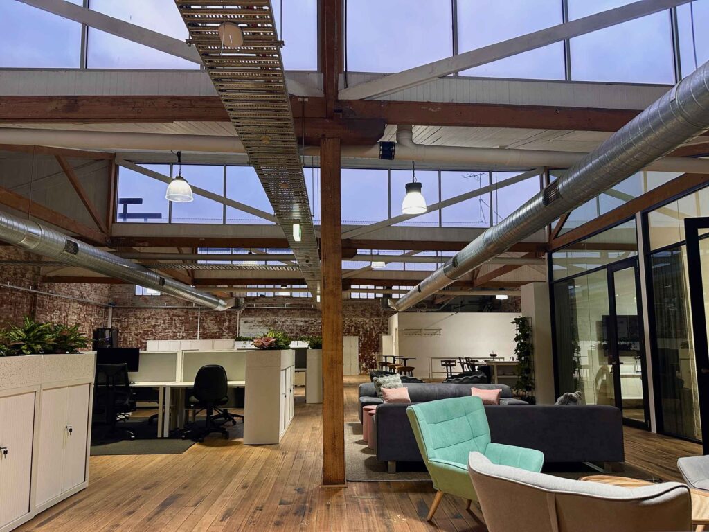 Early morning view of ko&co coworking lounge and meeting rooms with skylights and natural light in South Melbourne