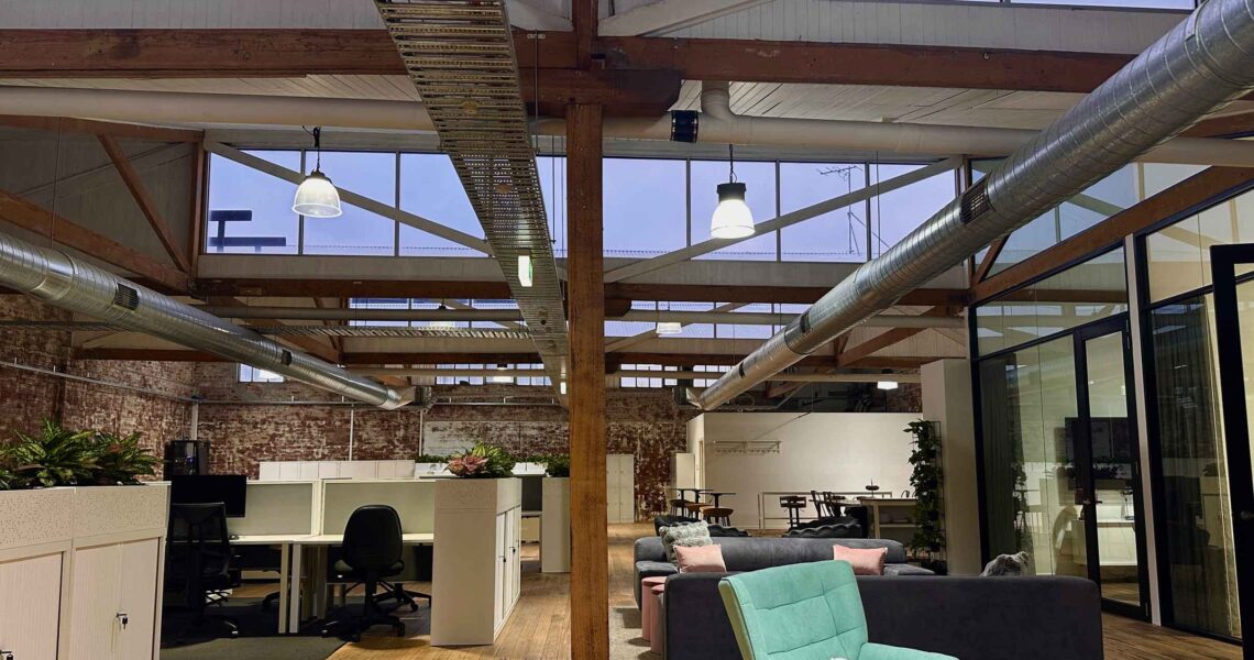 Early morning view of ko&co coworking lounge and meeting rooms with skylights and natural light in South Melbourne