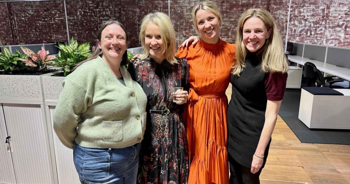 Kendra with three ko&co workhub members—solopreneurs in travel, recruitment, and admin—smiling during launch night