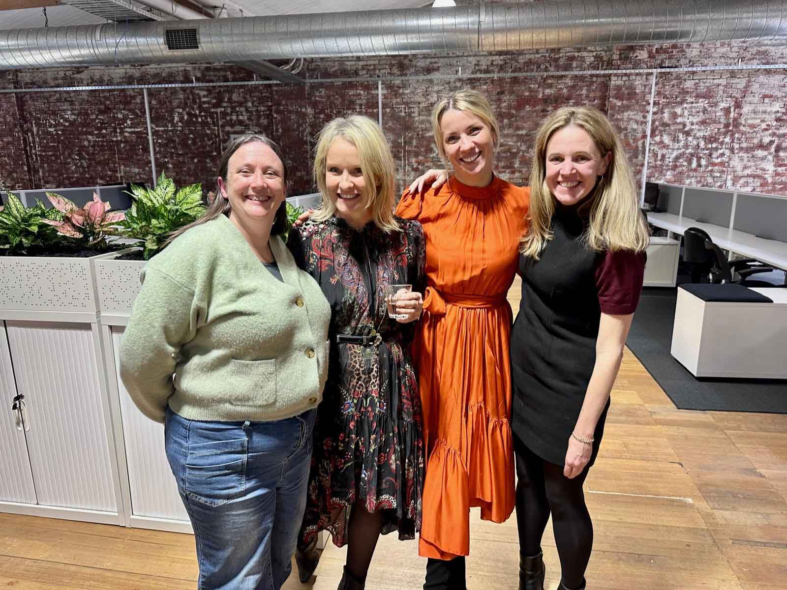 Kendra with three ko&co workhub members—solopreneurs in travel, recruitment, and admin—smiling during launch night