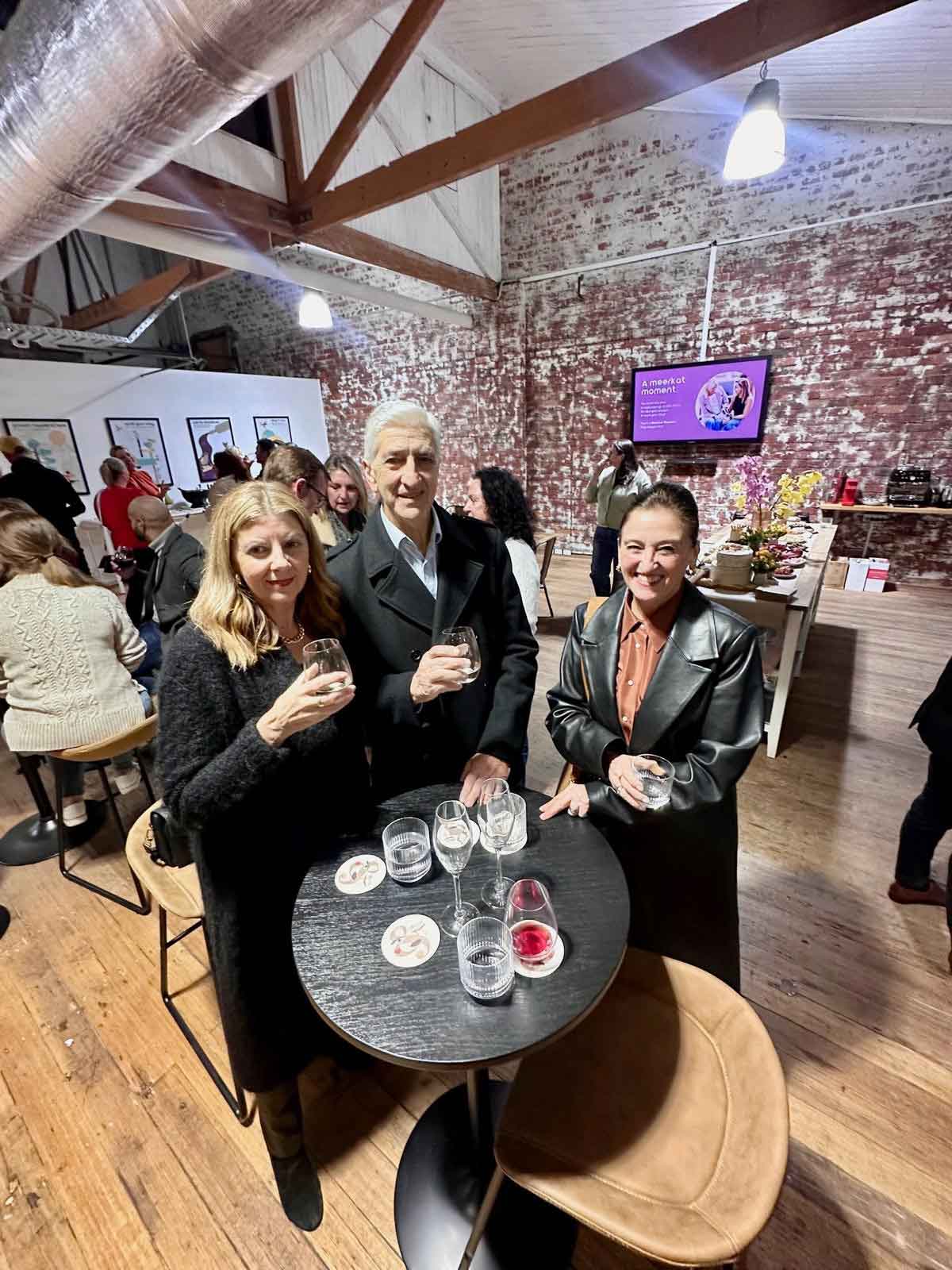 People gathered at ko&co workhub’s launch night in South Melbourne, enjoying drinks and conversation