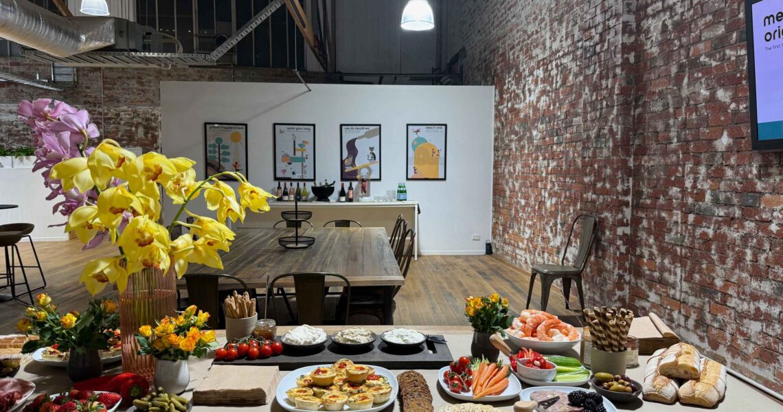 Grazing table at ko&co workhub launch night with digitally illustrated brand artwork in the background