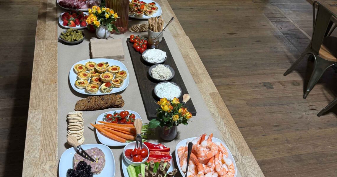 Flat lay photo of ko&co workhub grazing table with cheeses, crackers, fruits and dips