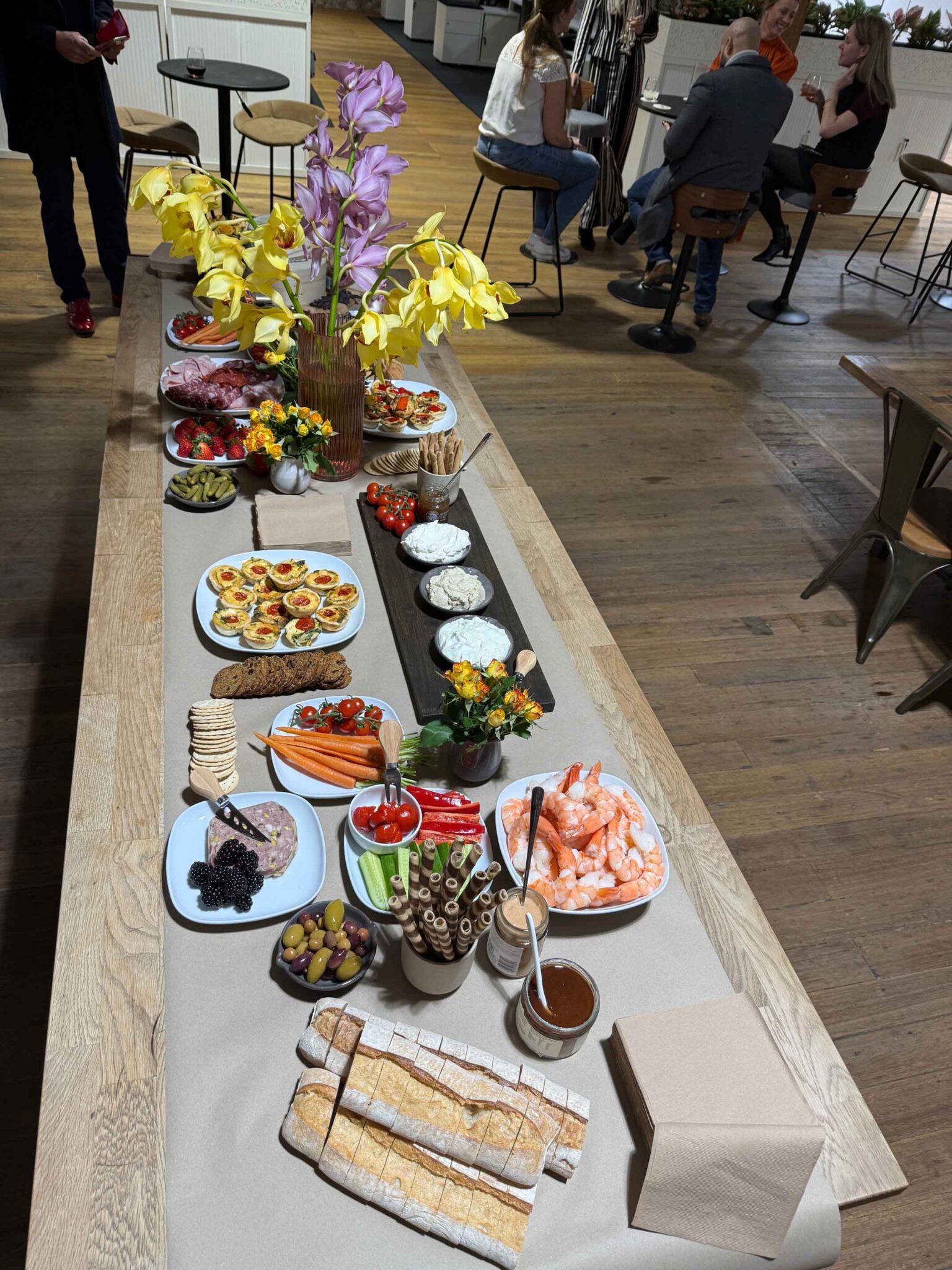 Flat lay photo of ko&co workhub grazing table with cheeses, crackers, fruits and dips