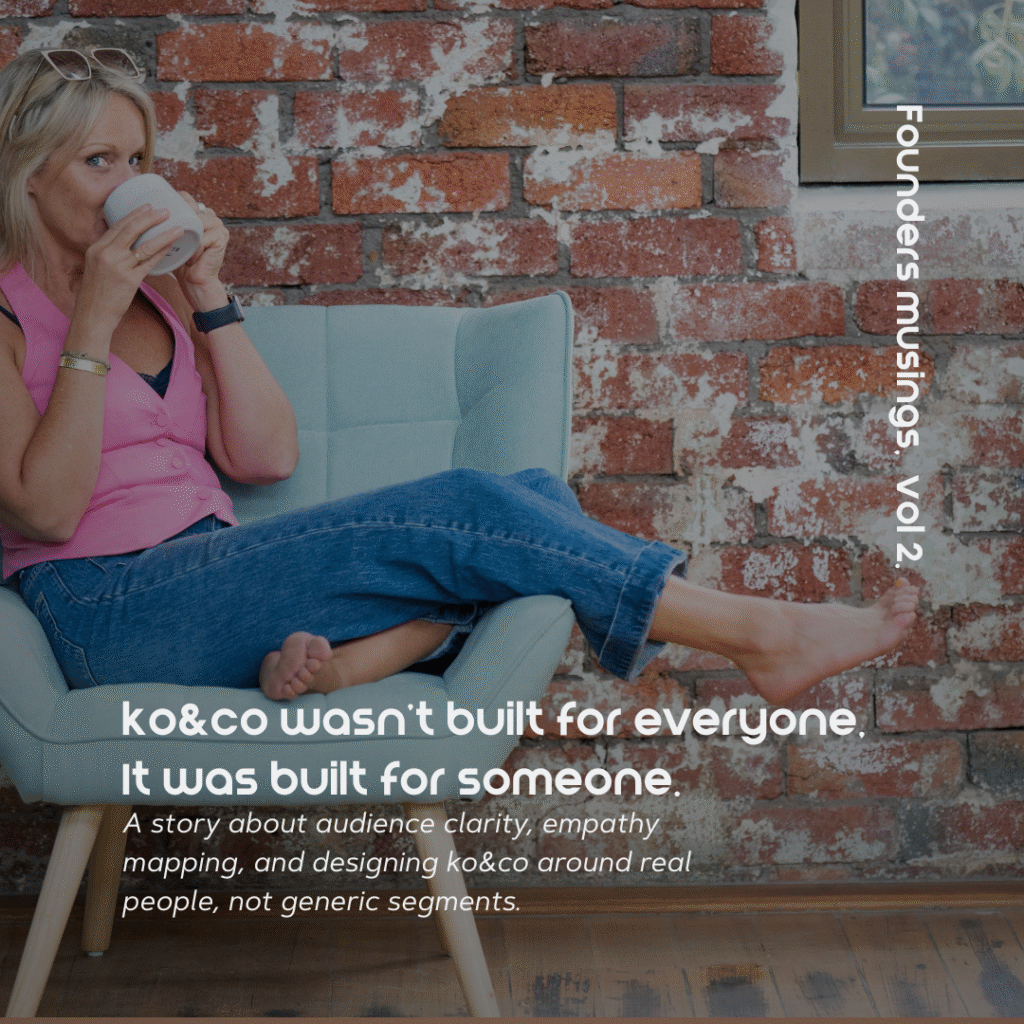 Kendra Overall, founder of ko&co workhub, sitting barefoot in a mint green armchair, sipping coffee and smiling toward the camera, with exposed brick wall in the background. Text overlay reads: “ko&co wasn’t built for everyone. It was built for someone.”